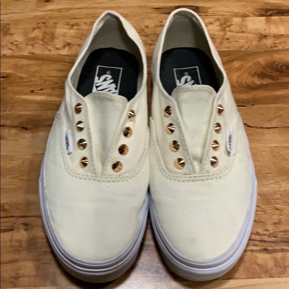 Vans cream with gold spikes.